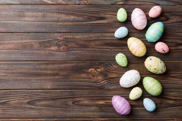 Happy Easter concept. Preparation for holiday. Easter eggs on colored background. flat lay top view copy space banner
