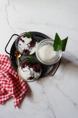 Bubur Ketan Hitam, Indonesian dessert. Black glutinous rice porridge with coconut milk, palm sugar and pandan leaf. 