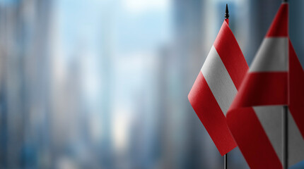 A small Austria flag on an abstract blurry background