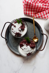 Bubur Ketan Hitam, Indonesian dessert. Black glutinous rice porridge with coconut milk, palm sugar and pandan leaf. 
