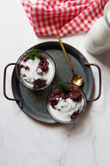 Bubur Ketan Hitam, Indonesian dessert. Black glutinous rice porridge with coconut milk, palm sugar and pandan leaf. 