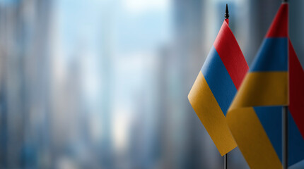Fototapeta na wymiar Small flags of the Armenia on an abstract blurry background