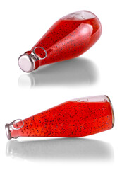 Set of red drinks with basil seeds or falooda seeds or tukmaria in bottles on white background