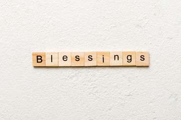 Blessings word written on wood block. Blessings text on cement table for your desing, Top view concept