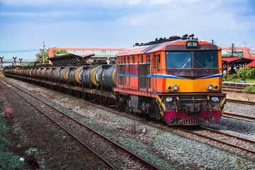 Fototapeta na wymiar Tanker-freight train by diesel locomotive passed the railway station.