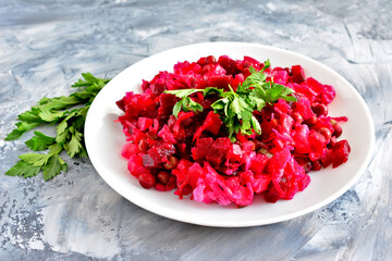 beetroot salad with sour cabbage and green peas isolated in white plate, macro