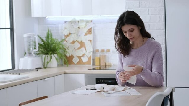 economical woman work on phone calculator at home pay bills taxes on gadget online, provident female calculate finances expenditures, manage plan family household budget on phone.