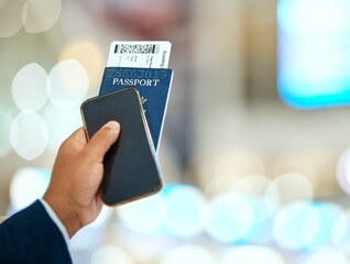 Airport, passport and ticket in hand with phone for online booking, travel and immigration...