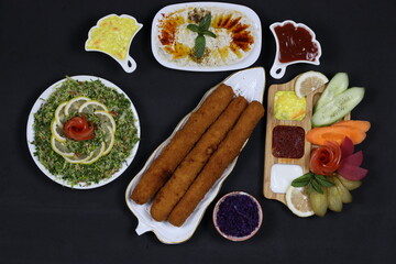 Fried Chicken Fingers as Main Dish - Mutabbal and Salads as Side Dishes - Simple Meal and Delicious Taste