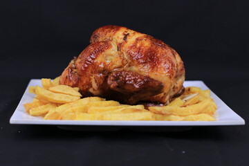 Grilled Chicken and French Fries Served on Plate Isolated on Black background | Premium Food Images