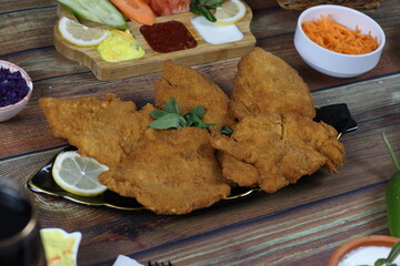 Fried Chicken Scallopini Nicely Served with Sacues and Grated Vegetables -  Warm Dinner Photos