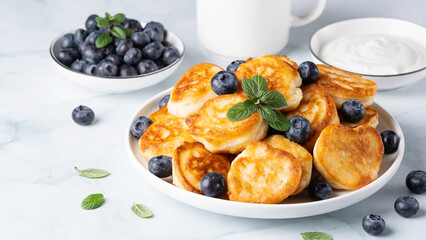 Homemade mini pancakes with blueberries. Copy Space for text