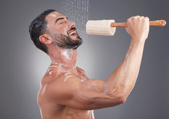 Shower, cleaning and man singing with brush in studio for skincare, washing body and wellness on...