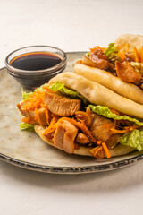 Steamed Asian-style bao buns filled with chicken, vertical photo.