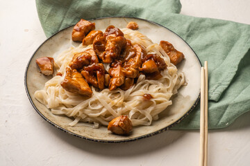 Asian-style wheat noodles with teriyaki chicken.