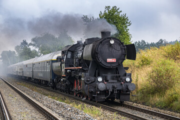 Fototapeta na wymiar German steam locomotive on a historic train