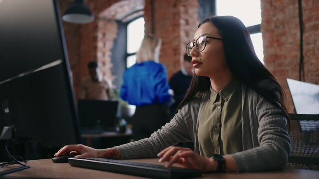 Mixed Race Woman Is Working In Office, Portrait At Computer, Asian Lady Is Accountant