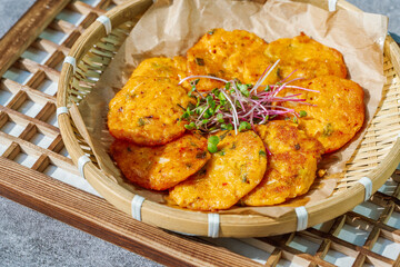 Kimchijeon, Korean Kimchi Pancake food : Slices of well-fermented kimchi mixed into a flour batter and pan- fried. Finely chopped pork, squid, and clam meat may be added to the batter as well.