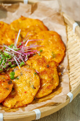 Kimchijeon, Korean Kimchi Pancake food : Slices of well-fermented kimchi mixed into a flour batter and pan- fried. Finely chopped pork, squid, and clam meat may be added to the batter as well.
