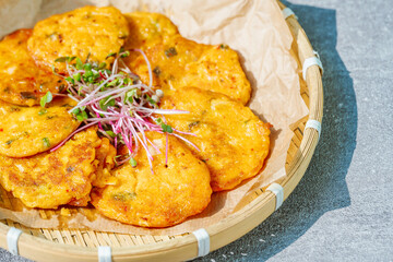 Kimchijeon, Korean Kimchi Pancake food : Slices of well-fermented kimchi mixed into a flour batter and pan- fried. Finely chopped pork, squid, and clam meat may be added to the batter as well.
