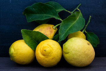 Lemon fruit.Lemon fruit with leaf isolated. Whole lemons on a wooden table