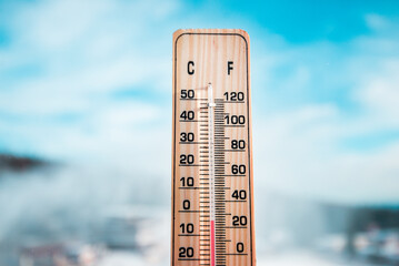 Winter time. Thermometer on snow shows low temperatures in celsius or fahrenheit.
