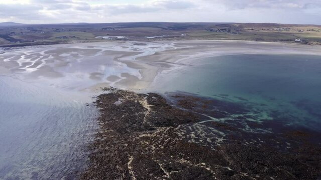 Drone shot of Gress beach on a sunny day on the Outer Hebrides of Scotland.