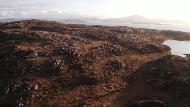 Drone shot of the peatland, seascape and moorland landscape around Bosta beach in Great Bernera looking towards Uig and the Isle of Harris in the South.