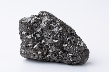 Natural black fossil coal on a white isolated background.