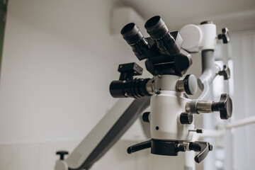 Dental Microscope on a background of a modern clinic closeup.