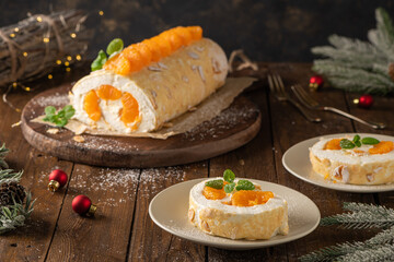 Meringue roll cake with cream, tangerine.