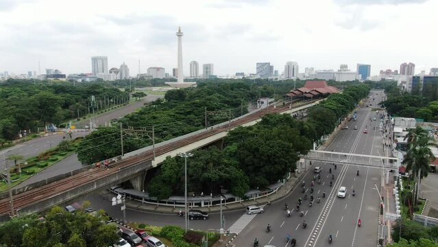 Aerial view of the National Monument with crowded vehicles at the gambir train station in the city of Jakarta, Indonesia