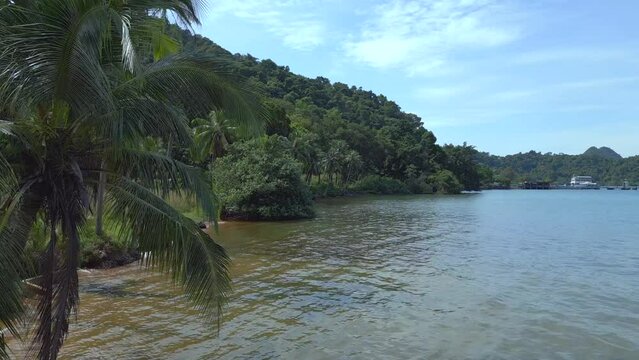 Amazing aerial view flight 
natural sand beach Koh chang island Thailand sunny day 2022. High Quality 4k Cinematic footage.
very close passing flight drone