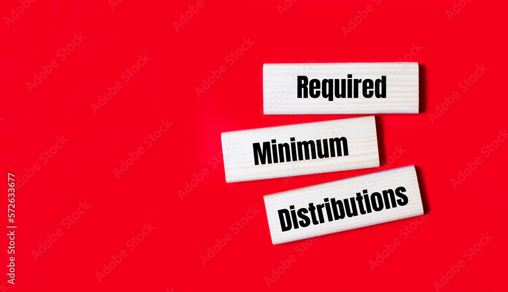 Poster three wooden blocks with the text rmd required minimum distributions on a bright red background. cop