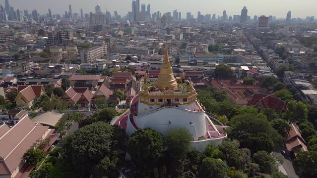 Fabulous aerial view flight 
Bangkok Tempel thailand Wat Saket Golden Mount, sunny day 2022. High Quality 4k Cinematic footage.
wide orbit overview drone
