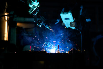 Obraz na płótnie Canvas Metal welder specialist working with arc welding machine