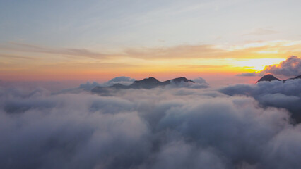 aerial photo above the clouds view of the sky at dusk