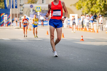 male racewalker at distance in athletics competition