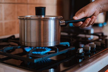 Modern kitchen stove cook with blue flames burning.