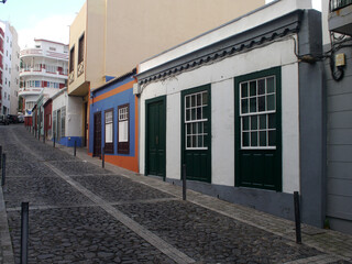 A steep quiet street in Santa Cruz de La Palma with typical Portuguese houses