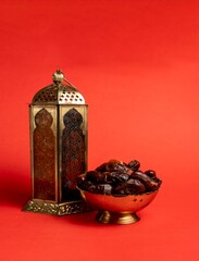 Ramadan Kareem Red Colour Background, Traditional Lantern lamp with dates Iftar and Eid Mubarak greeting image