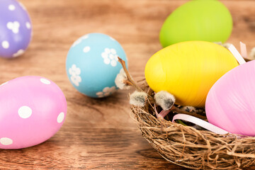 Colorful Easter eggs on wooden background. Easter concept.