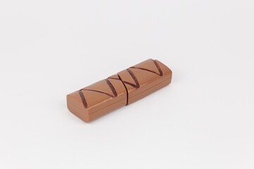plastic children's toy chocolate bar candy on a white background