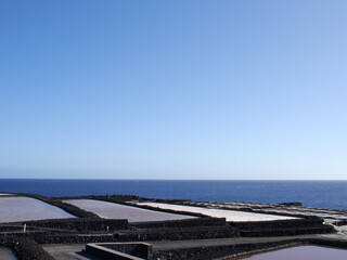 Sea Salt production, La Palma. Salt pans with sea salt drying in sunlight