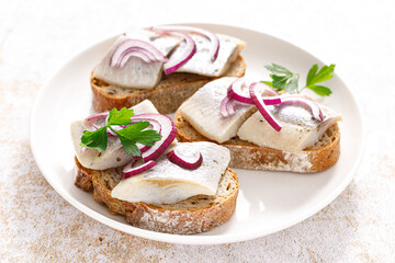 Herring sandwich. Toast with bread, herring and onion. Top view