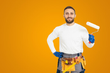 Young construction workers on a colored background