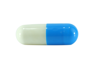 One colorful capsule isolated on white background.