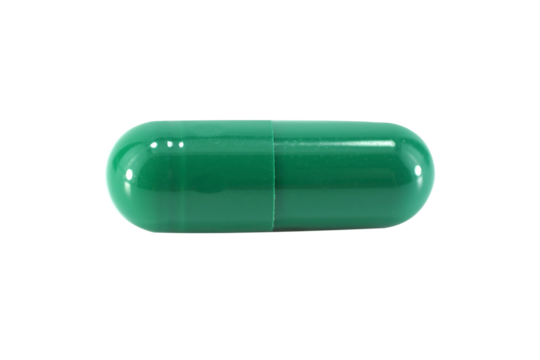 green capsule pills isolated on white background.