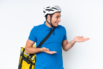 Young caucasian man with thermal backpack isolated on white background with surprise facial expression