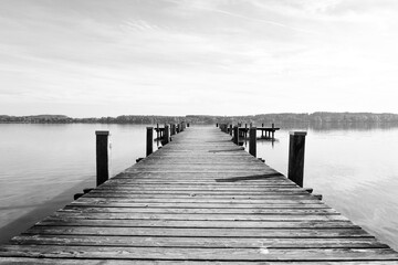 Fototapeta premium Idyllic landscape in the morning with a pier on the lake. 